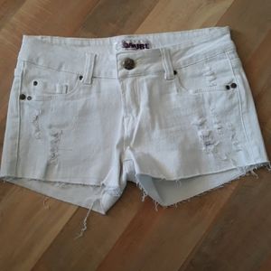 Distressed white jean shorts